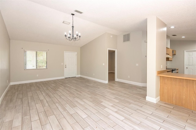 35 Brockton Ln, Palm Coast, FL 32137 - unfurnished living room featuring a chandelier, light wood-type flooring, baseboards, vaulted ceiling, and recessed lighting