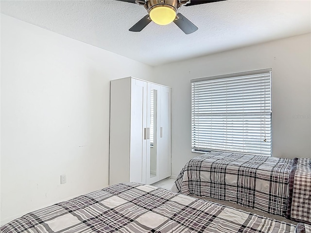 1578 Stone Trl, Deltona, FL 32725 - bedroom featuring ceiling fan and a textured ceiling
