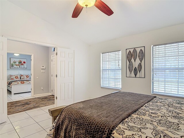 1578 Stone Trl, Deltona, FL 32725 - bedroom featuring vaulted ceiling, light tile patterned floors, and a ceiling fan