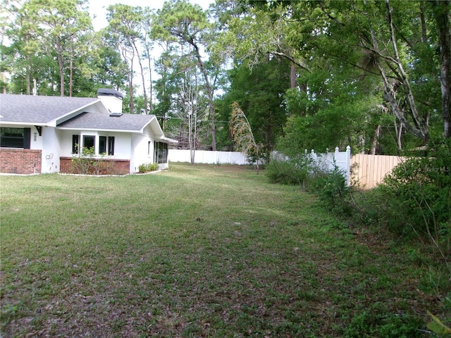 view of yard featuring fence