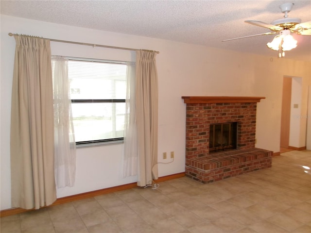 unfurnished living room featuring a textured ceiling, a fireplace, baseboards, and a ceiling fan