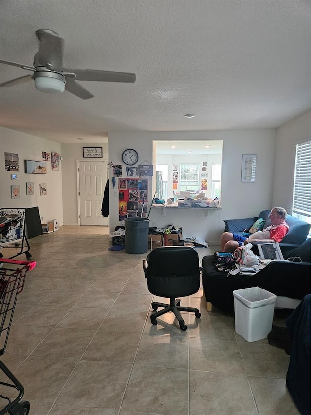 209 Meghan Cir, Deland, FL 32724 - living area featuring ceiling fan and a textured ceiling