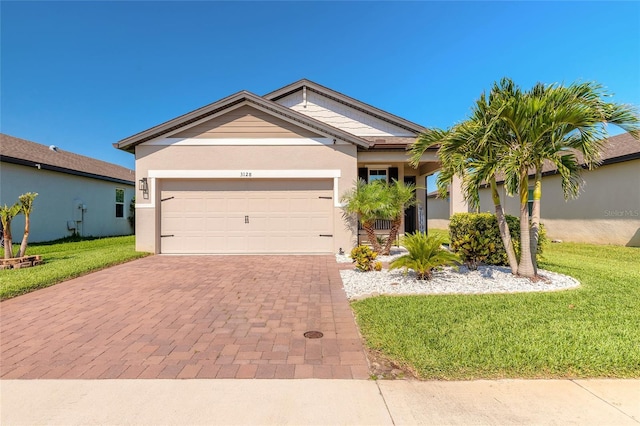 3128 Crab Trap Dr, New Smyrna Beach, FL 32168 - single story home featuring a front yard, decorative driveway, an attached garage, and stucco siding