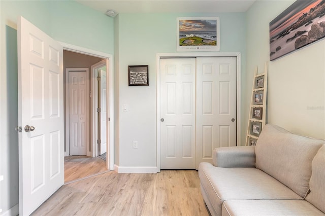3128 Crab Trap Dr, New Smyrna Beach, FL 32168 - sitting room featuring light wood-style floors and baseboards