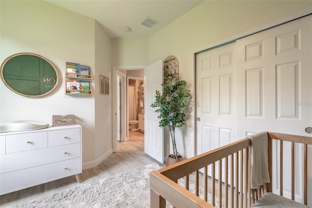 3128 Crab Trap Dr, New Smyrna Beach, FL 32168 - bedroom with light wood finished floors, a closet, a nursery area, and baseboards