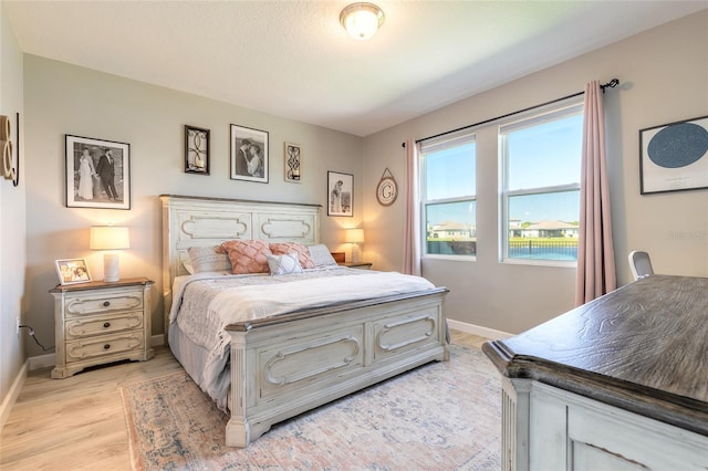 3128 Crab Trap Dr, New Smyrna Beach, FL 32168 - bedroom with light wood-type flooring and baseboards