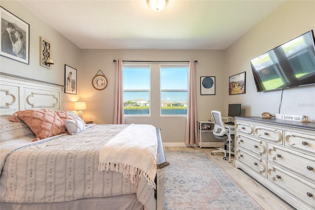 3128 Crab Trap Dr, New Smyrna Beach, FL 32168 - bedroom featuring an office area and light wood finished floors