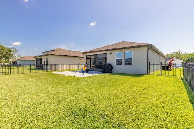 3128 Crab Trap Dr, New Smyrna Beach, FL 32168 - rear view of property with stucco siding, a patio, and a sunroom