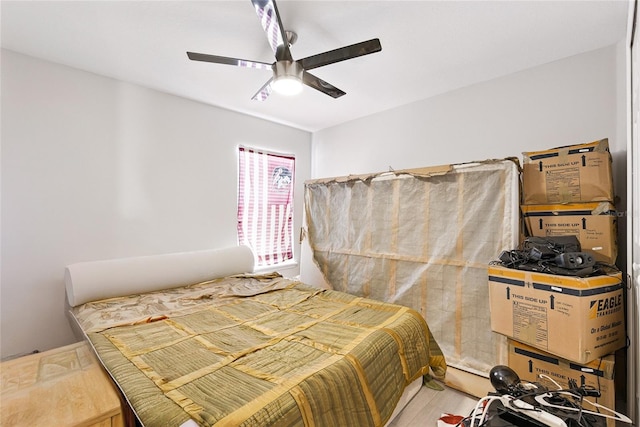 bedroom with wood finished floors and a ceiling fan