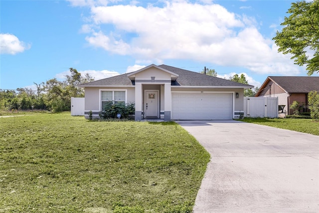 view of front of home with a gate, driveway, an attached garage, a front yard, and stucco siding