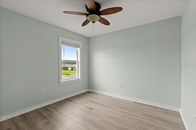3120 Areca Ave, New Smyrna Beach, FL 32168 - unfurnished room featuring ceiling fan, light wood-style floors, and baseboards