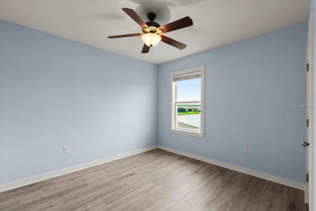3120 Areca Ave, New Smyrna Beach, FL 32168 - empty room with baseboards, light wood finished floors, and ceiling fan
