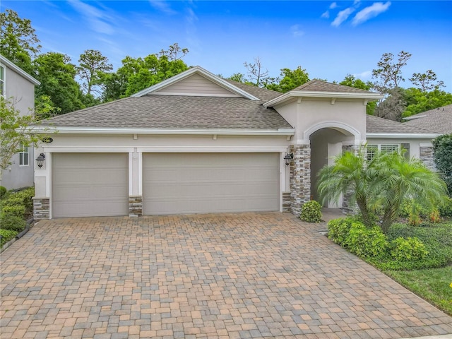 425 Wedgeworth Ln, Deland, FL 32724 - view of front of property featuring decorative driveway, stucco siding, and roof with shingles