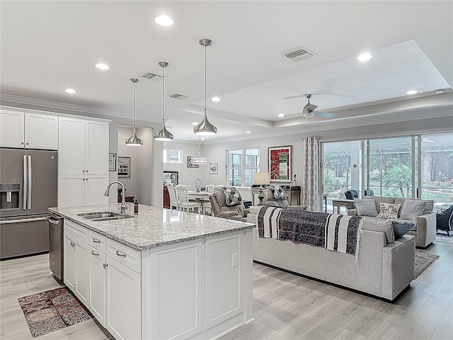 425 Wedgeworth Ln, Deland, FL 32724 - kitchen featuring a sink, visible vents, white cabinets, appliances with stainless steel finishes, and ceiling fan