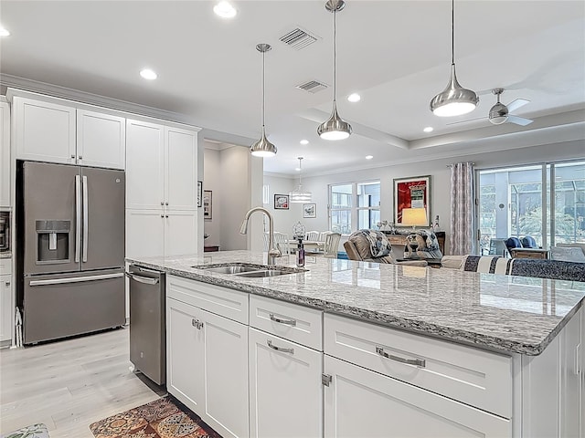 425 Wedgeworth Ln, Deland, FL 32724 - kitchen with a wealth of natural light, visible vents, a sink, and stainless steel appliances