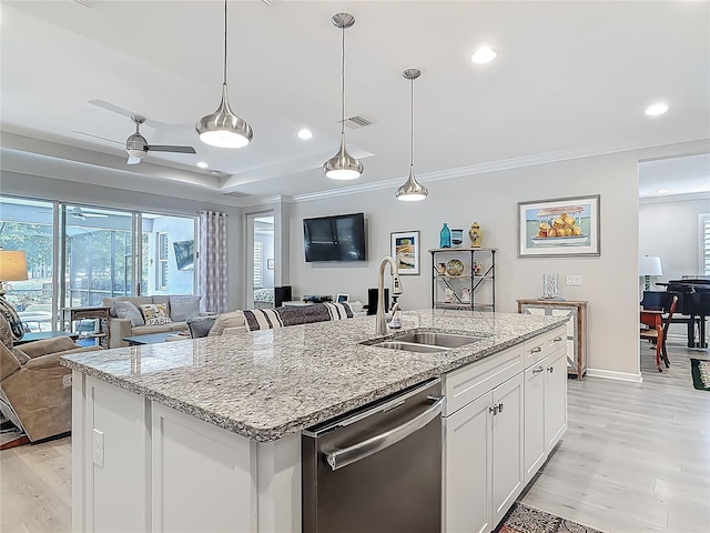 425 Wedgeworth Ln, Deland, FL 32724 - kitchen with a sink, light wood finished floors, stainless steel dishwasher, open floor plan, and recessed lighting