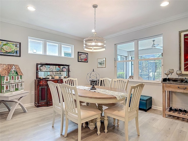 425 Wedgeworth Ln, Deland, FL 32724 - dining space featuring light wood-type flooring, crown molding, and a healthy amount of sunlight