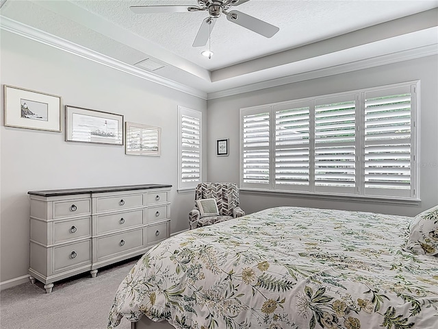 425 Wedgeworth Ln, Deland, FL 32724 - bedroom featuring crown molding, a raised ceiling, light carpet, a textured ceiling, and ceiling fan