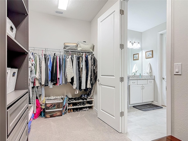 425 Wedgeworth Ln, Deland, FL 32724 - walk in closet with visible vents and carpet