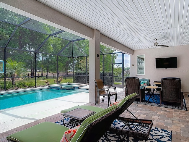 425 Wedgeworth Ln, Deland, FL 32724 - view of swimming pool featuring glass enclosure, ceiling fan, a pool with connected hot tub, and a patio area