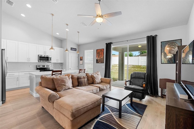 1601 Toledo Ave, Deltona, FL 32725 - living room featuring light wood-type flooring, high vaulted ceiling, a ceiling fan, and visible vents