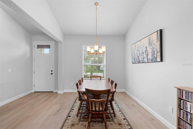 1601 Toledo Ave, Deltona, FL 32725 - dining area featuring light wood finished floors, an inviting chandelier, and baseboards