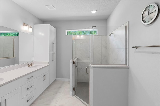 1601 Toledo Ave, Deltona, FL 32725 - full bathroom featuring double vanity, a stall shower, a textured ceiling, marble finish floor, and a sink