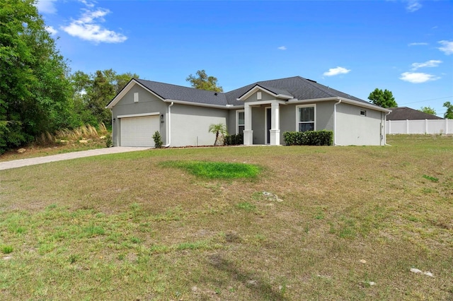 1601 Toledo Ave, Deltona, FL 32725 - single story home featuring stucco siding, a front yard, fence, an attached garage, and concrete driveway