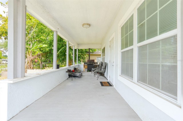 5261 3rd St, Orlando, FL 32810 - view of patio / terrace with a porch and a grill