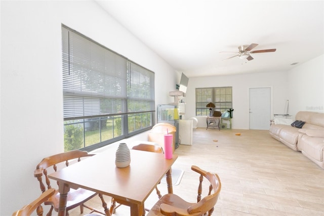 5261 3rd St, Orlando, FL 32810 - dining room with light wood finished floors and ceiling fan