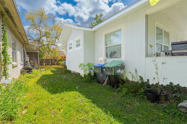 5261 3rd St, Orlando, FL 32810 - exterior space with a lawn and stucco siding