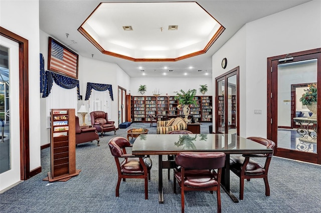 5305 Indian Ocean Loop, Tavares, FL 32778 - dining room featuring carpet flooring, a raised ceiling, recessed lighting, and baseboards