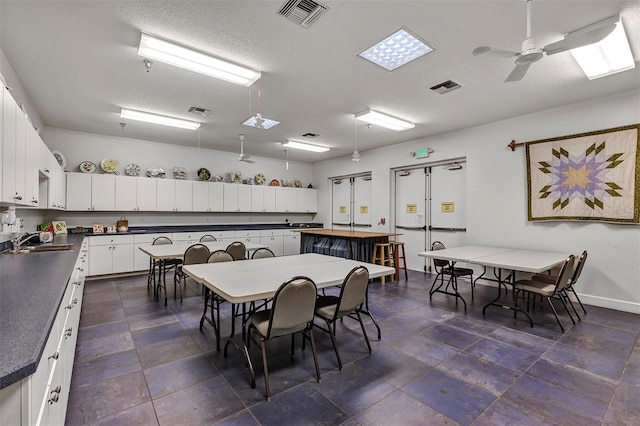 5305 Indian Ocean Loop, Tavares, FL 32778 - dining area featuring ceiling fan and baseboards