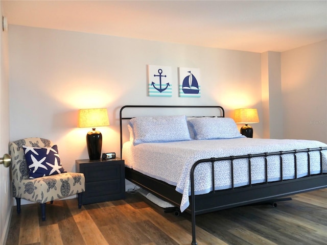 bedroom featuring wood finished floors