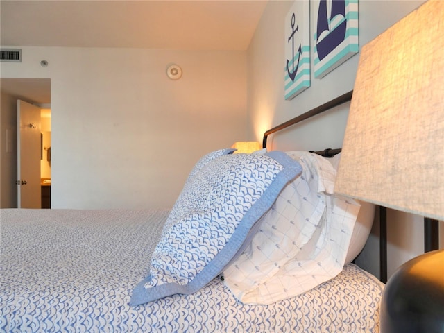 bedroom featuring visible vents