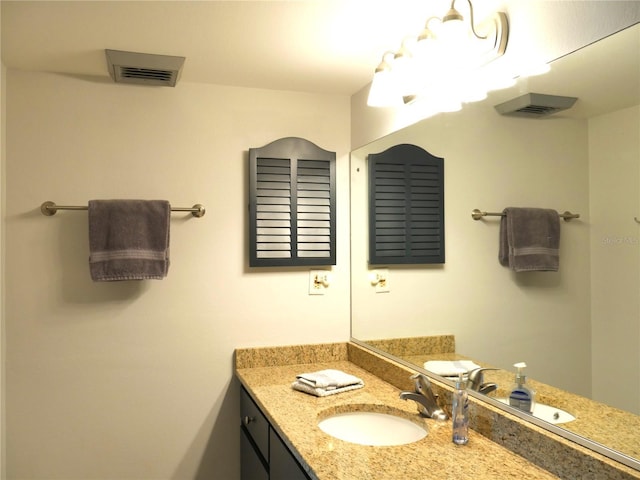 bathroom with visible vents and vanity