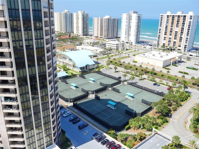 birds eye view of property featuring a view of city and a water view