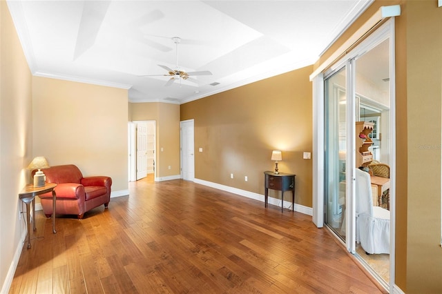 508 Quail Lake Dr, Debary, FL 32713 - sitting room featuring crown molding, hardwood / wood-style flooring, ceiling fan, baseboards, and a raised ceiling