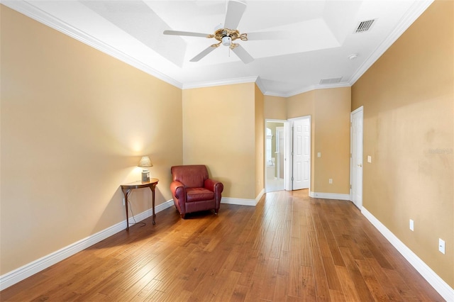 508 Quail Lake Dr, Debary, FL 32713 - living area with wood-type flooring, ceiling fan, crown molding, and baseboards
