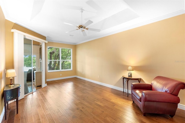 508 Quail Lake Dr, Debary, FL 32713 - living area featuring wood finished floors, crown molding, baseboards, and ceiling fan