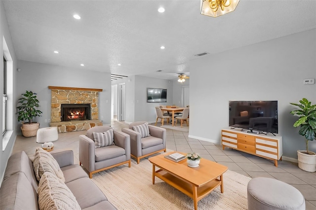 living area with recessed lighting, visible vents, light tile patterned flooring, a fireplace, and ceiling fan
