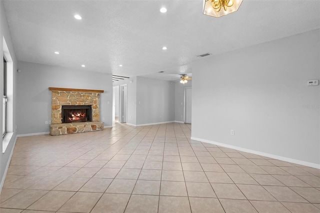 unfurnished living room featuring recessed lighting, a stone fireplace, visible vents, and a ceiling fan