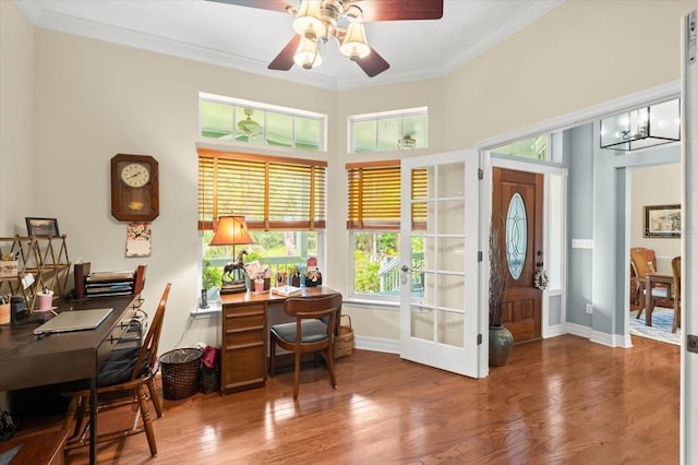 office area featuring ceiling fan, baseboards, crown molding, and wood finished floors