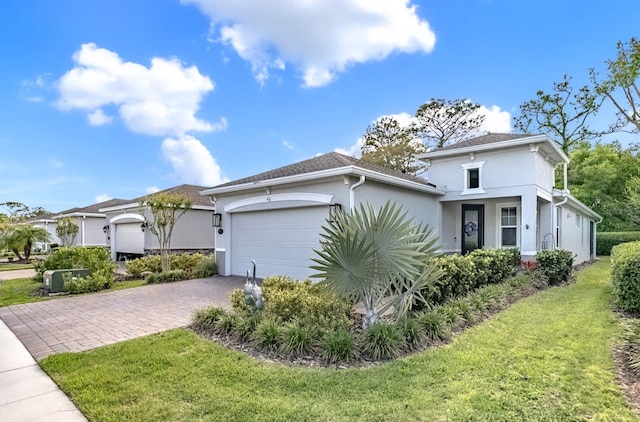 view of property exterior featuring a yard, an attached garage, driveway, and stucco siding