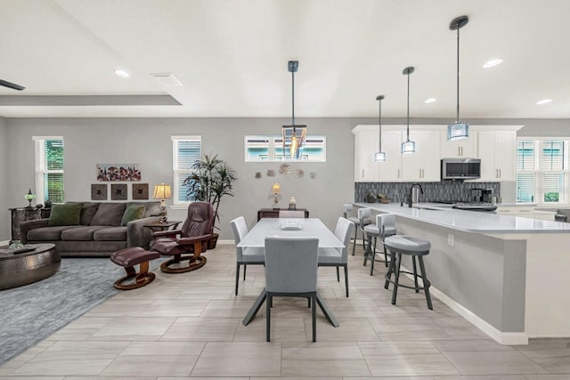 dining area with visible vents, a wealth of natural light, and recessed lighting
