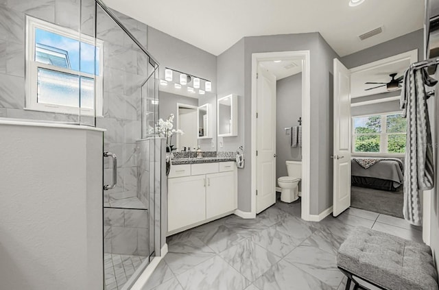bathroom featuring toilet, a shower stall, visible vents, ceiling fan, and marble finish floor