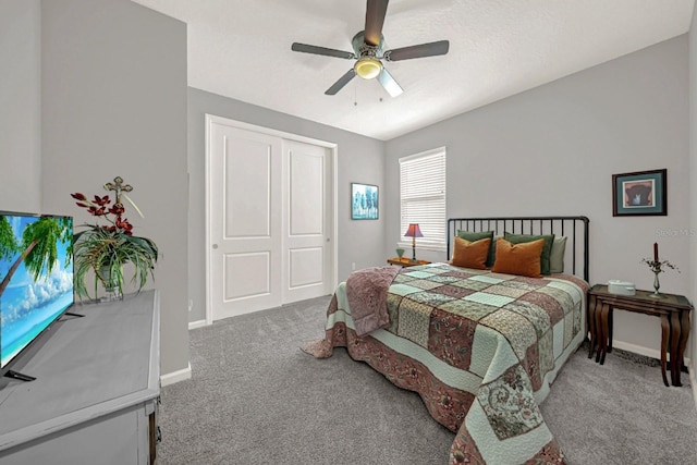 bedroom with baseboards, a ceiling fan, and carpet