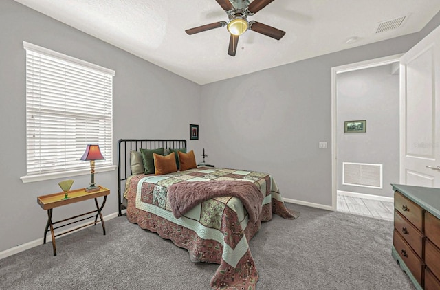 bedroom featuring baseboards, visible vents, and carpet floors