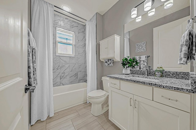 bathroom featuring toilet, shower / bath combo with shower curtain, and vanity