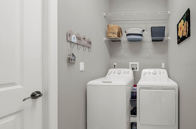 laundry room featuring laundry area and washing machine and clothes dryer